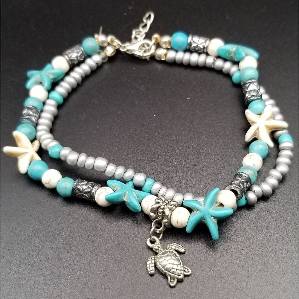 Surfing and sun turtle charm bracelet. B511